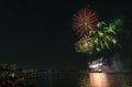 Fireworks over the ocean in the big city, silhouettes of people Royalty Free Stock Photo