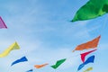 Multicolored flags against the blue sky Royalty Free Stock Photo