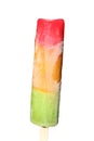 Multicolored frozen ice on a wooden stick isolated on a white background. Delicious ice cream red, orange, green colors