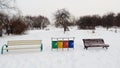 Multicolored garbage can garbage container for municipal waste and industrial waste, snow, winter, ecology