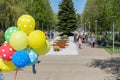 Multicolored gel balloons in the hand of a people