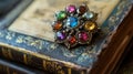 Multicolored Gemstone Brooch on Antique Book Royalty Free Stock Photo