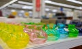 Multicolored glass bottles stand on the counter of the store Royalty Free Stock Photo