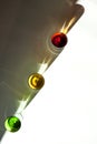 Multicolored glasses on white. Royalty Free Stock Photo