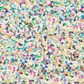 Multicolored glitter, sparkle confetti texture. Christmas abstract background. Ideal seamless pattern. Royalty Free Stock Photo