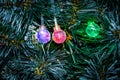 Multicolored glowing Christmas balls garlands close-up