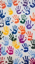 Multicolored handprints scattered across a white surface, reflecting creativity and community