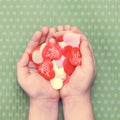 Multicolored hearts for Valentine`s day in children`s hands