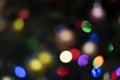 Multicolored holiday lights. Lights on the christmas tree, defocused Royalty Free Stock Photo