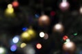 Multicolored holiday lights. Lights on the christmas tree, defocused Royalty Free Stock Photo
