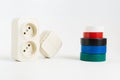 multicolored insulating tape,double socket,two-key light switch.white background