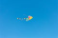 Multicolored kite in blue sly Royalty Free Stock Photo
