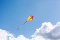A multicolored kite soars in the sky Royalty Free Stock Photo