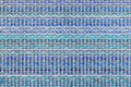 Multicolored knitted fabric background texture. ÃÂ¡olorful blue fabric with a pattern. Fragment colored wool carpet, bright wicker Royalty Free Stock Photo