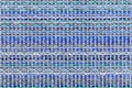 Multicolored knitted fabric background texture. ÃÂ¡olorful blue fabric with a pattern. Fragment colored wool carpet, bright wicker Royalty Free Stock Photo