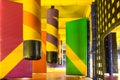 Multicolored labyrinth with hanging soft pillars and other obstacles in the children`s play complex