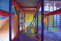 Multicolored labyrinth with ropes and other obstacles in the children`s play complex, overcoming obstacles