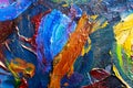 Multicolored large strokes of oil paint in blue, red and yellow shades on canvas, close up. Creative conception of Royalty Free Stock Photo