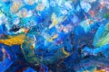 Multicolored large strokes of oil paint in blue, red and yellow shades on canvas, close up. Creative conception of Royalty Free Stock Photo
