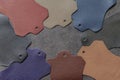 Multicolored leather samples on dark leather, abstract background, choice of colors, shades color. Top view