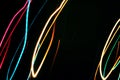 Multicolored lines fire light painting on night dark black background. Celebration holiday concept Royalty Free Stock Photo