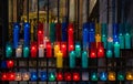 Multicolored lit church candles Royalty Free Stock Photo