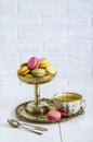 Multicolored macaroons in a vintage bowl