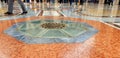 A multicolored marble floor with people walking on it. Milan, Italy Royalty Free Stock Photo