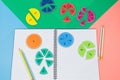 Multicolored math fractions on the open notepad. Interesting mathematics, geometry shapes for kids. Education, back to school