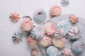 Multicolored meringue on wooden tray