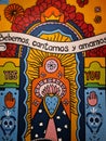 Multicolored Mexican wall with skulls, patterns, flowers and signatures