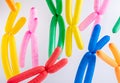 Multicolored modeling balloons as x chromosomes on white background