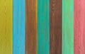 Multicolored modern wooden background. The boards are arranged vertically