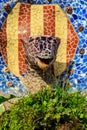 Multicolored mosaic snake of Gaudi in Park Guell, Barcelona, Spain