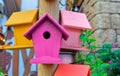 Multicolored nesting boxes closeup outdoor background