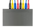 Multicolored network cables connected to router on a white Royalty Free Stock Photo