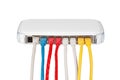 Multicolored network cables connected to router on a white background Royalty Free Stock Photo