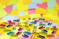 Multicolored office metal staples for stapler on multicolored paper Sticky Notes Royalty Free Stock Photo