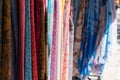 Multicolored ÃÂolorful scarfs in a tourist souvenir store, textile market.