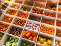 Multicolored orange beads in boxes in a shop Royalty Free Stock Photo