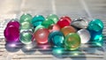 Multicolored Orbeez, expanding colorful jelly water balls on white background.