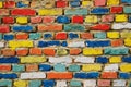 Multicolored painted bricks, exterior wall as background Royalty Free Stock Photo
