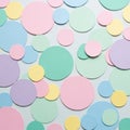 Multicolored paper circles of various sizes are scattered randomly on a flat surface. Royalty Free Stock Photo