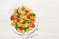 Multicolored pasta on light background