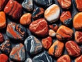 Multicolored pebbles, marble stones seamless pattern isolated on black background