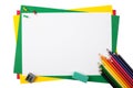 Multicolored pencils on a frame from colored paper Royalty Free Stock Photo