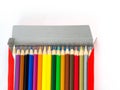 Multicolored pencils with free space for text on white background, Color pencils in box isolated Royalty Free Stock Photo