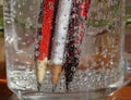 Colorful pencils immersed in a liquid make an interesting background.