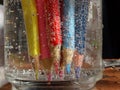 Colorful pencils immersed in a liquid make an interesting background.