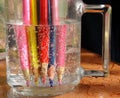 Colorful pencils immersed in a liquid make an interesting background.